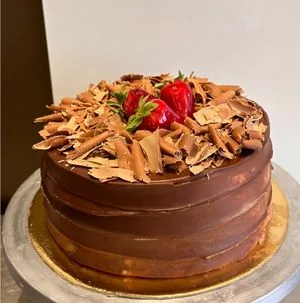 A chocolate cake topped with strawberries